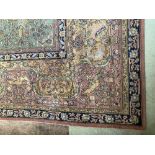 A pair of Oriental style machine made lime ground Carpets, each with pink and ivory medallion