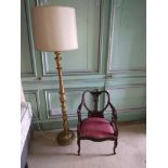 A gilt leaf moulded Lamp Standard;ÿtogether with an inlaid and carved Edwardian Armchair of low