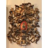 A magnificent 18th Century Baroque carved Armorial Wall Piece,ÿin the rococo style, the crest with