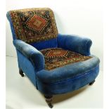 A good Victorian Easy Armchair, probably by Strahan, Dublin, covered in blue velvet and tapestry