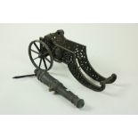A very heavy Continental cast bronze Floor Cannon, 19th Century, the two wheel carriage with