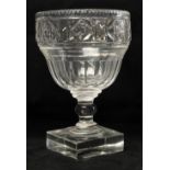 A 19th Century Irish cutglass tall Centre Bowl, with beaded rim, and tapering shape on heavy