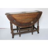 An attractive 18th Century carved walnut gate leg Table,ÿthe top carved with trellis design and