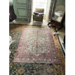 A semi-antique Persian Rug, with all over tree of life design, with birds and flowers on an ivory