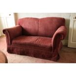 A Victorian style Easy Armchair, with padded back, sides and seat on front baluster turned legs;