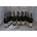 Twelve Bottles of Taylors 1985 Vintage Port, (imported by Woodforde Bourne), labels worn and damp