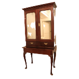 A mahogany Cabinet on Stand, 19th Century Irish in the 18th Century style, the moulded cornice above