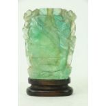 An attractive 19th Century carved spinage jade Snuff Bottle, decorated with foliage on an oval