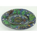 A large Majolica Palissy type oval Dish, with fish, shell fish, reptiles and seaweed in relief, 18