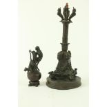 A 19th Century cut bronze Centrepiece, the square flared base with grotesque masks united by fruit