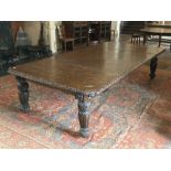 A Victorian period Cromwellian style extending Dining Table, with three spare leaves, the carved