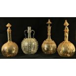 Three similar Dutch yellow ground glass Decanters and stoppers, overlaid with glass ribbons and