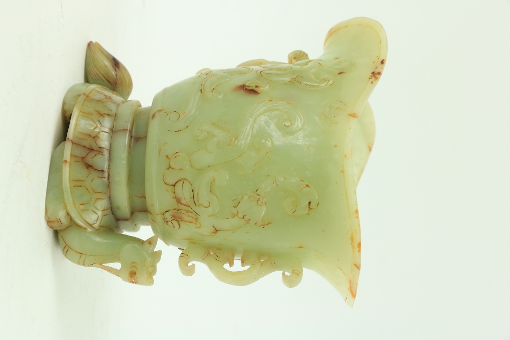 A fine carved Chinese jade Libation Cup, carved in relief with scrolls under a double spout and - Image 2 of 2