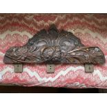 Two early carved oak Capitals or Picture Mounts, one depicting acanthus leaf, pineapple and foliage,