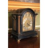 A good quality and attractive Victorian Bracket Clock, the arched top with brass finials, over a