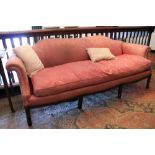 A Georgian style mahogany framed humpback Settee, covered in pink damask fabric, with scrolled arms,