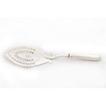 A George III Irish bright cut silver Fish Slice, monogrammed with coronet, the pierced blade with