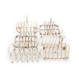 A concertina action plated six slice Toast Rack, another with circular sections, another with arched