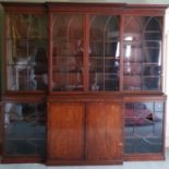 A fine quality Georgian mahogany breakfront Bookcase, the dentil moulded cornice over four Gothic