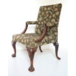 An 18th Century Gainsborough type Library Armchair, possibly Irish, with padded back, elbow rest and