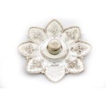 An attractive silver star shaped and floral chased Inkstand, presented to Cecil H. Gaisford, by a