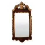 A fine quality 18th Century shield shaped carved giltwood and walnut Wall Mirror, with swan neck