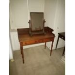 A William IV period mahogany Dressing Table, with three quarter gallery above two frieze drawers and