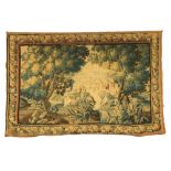 A 17th Century Flemish Verdure Tapestry, with castellated town beyond, trees and exotic birds to the