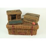 A large Picnic Basket, partly furnished, two smaller Picnic Baskets (unfurnished), a large oval