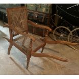 A Victorian inlaid Sedan type lift Armchair, with six handles, cane back and seat. (1)
