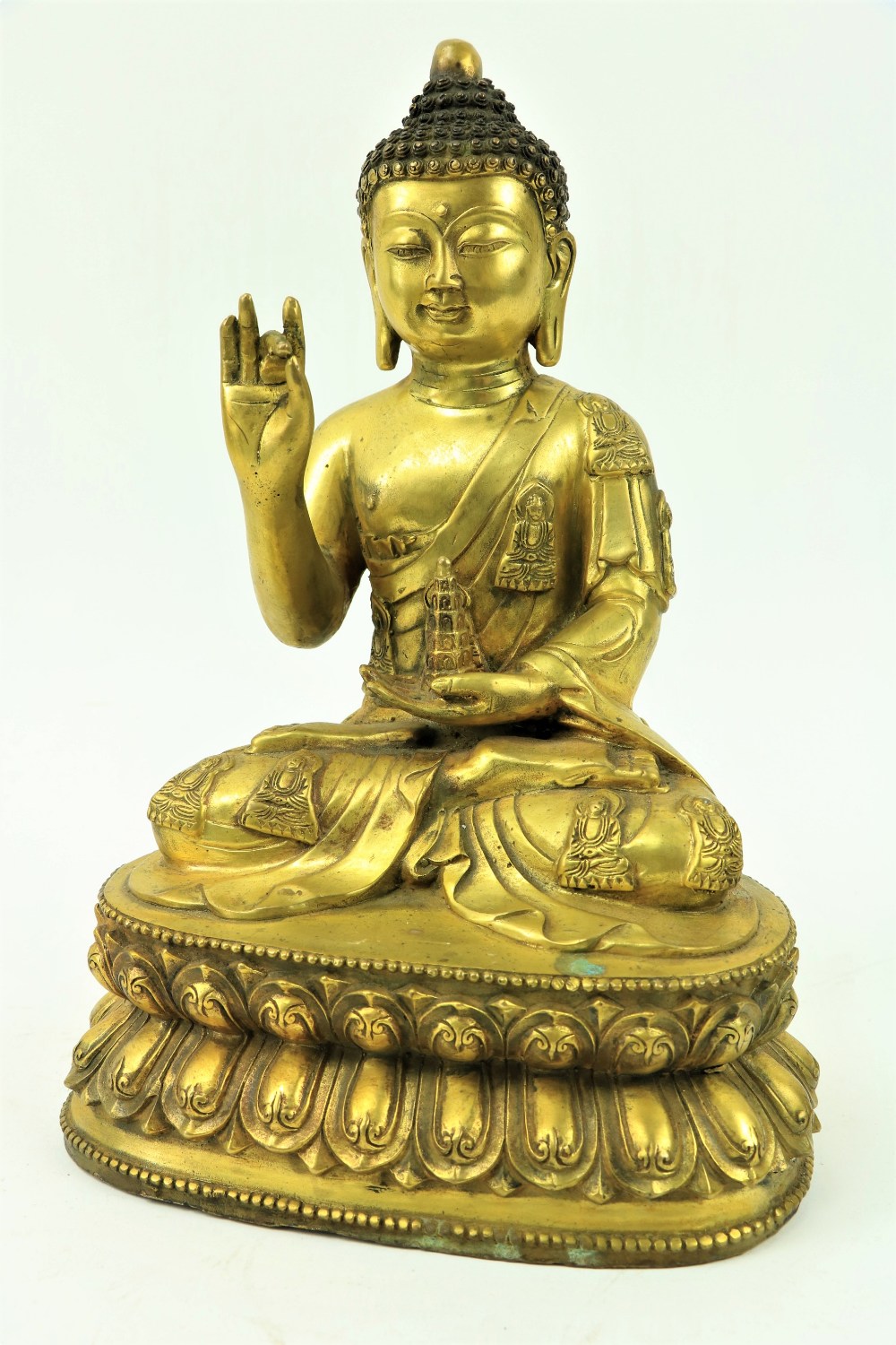 A fine quality large Chinese gilt bronze Figure, of a Buddha, seated on a double lotus base, the