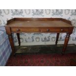 A late Victorian mahogany Dressing Table, with three-quarter gallery and two frieze drawers on