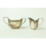 An Art Nouveau decorated English silver Cream Jug, and a two handled bowl by William Hutton and Sons