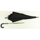 Militaria:  A 19th Century Gentleman's Umbrella, with ebony and carved bone handle, black parasol,