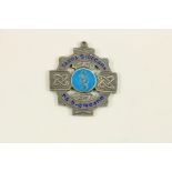 Medal: G.A.A. - Garda Siochana Medal The obverse with pierced Celtic design and enamelling inscribed