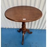 Oval mahogany tripod table, marks on top, 24”(61cm) deep x 17” (43cm)wide x 29.5”(75cm)high