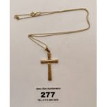 9k gold chain with 9k cross pendant, w. 2 gms. Length of chain 8.75” (22cm) and cross 1.25” (3cm)