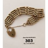 9k gold gate bracelet with heart lock, w: 24.5 gms, length 8” (20cm)