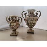 2 Derby vases. 11.5”(29cm) high and 9” (22.5cm) high. Larger one has repair to handle, chip on