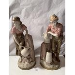 Large pair of Royal Dux figures, boy and girl water carriers. Boy is 24” (61cm) high and girl is 23”