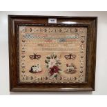 Wood framed sampler by Ann Jane Sykes, age 8, 1848. Sampler 11.5” x 10” (29cm x 25.5cm), framed