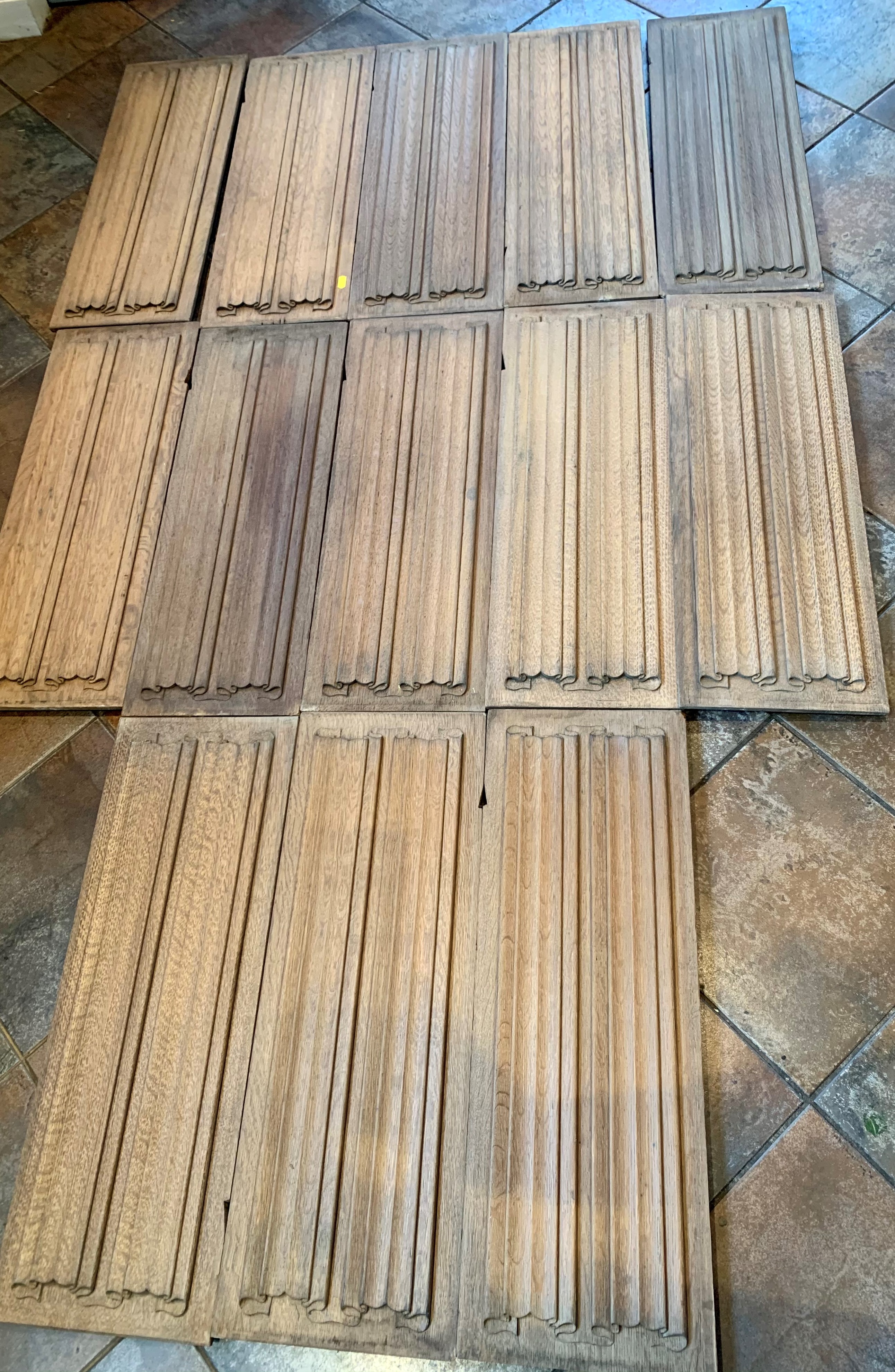 13 vintage fielded wooden panels, 26” (67cm) long x 9.5” (24cm) wide x 1” (2.5cm) deep.