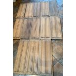 13 vintage fielded wooden panels, 26” (67cm) long x 9.5” (24cm) wide x 1” (2.5cm) deep.