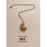 Rolled gold locket on thin unmarked chain