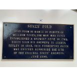 Cast iron sign “Sykes Fold” from Tetleys Brewery, Leeds. 22” (56cm) long x 11.5” (29cm) wide.