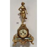 Gilt and onyx mantle clock marked “Medaille D’Argent” with pendulum and figure on top marked
