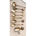 7 assorted souvenir spoons and plated strainer spoon