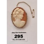 9k gold framed cameo brooch, total w: 10.3 gms, length 1.75” (4.5cm)