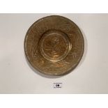 Round brass plate with Chinese marks. 8” (20.5cm) diameter.