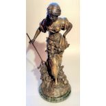 Large metal figure of woman on marble base. Holes in back been made for lamp. Named Maceau. Made